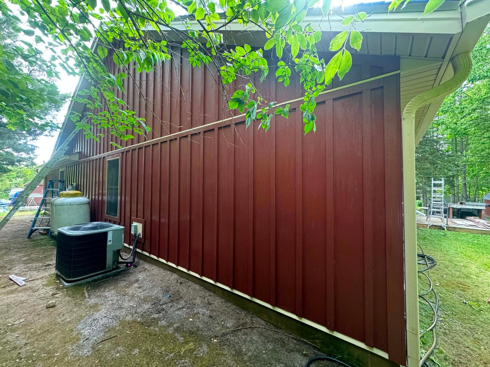 Before: weathered board-and-batten siding on the same Ohio home